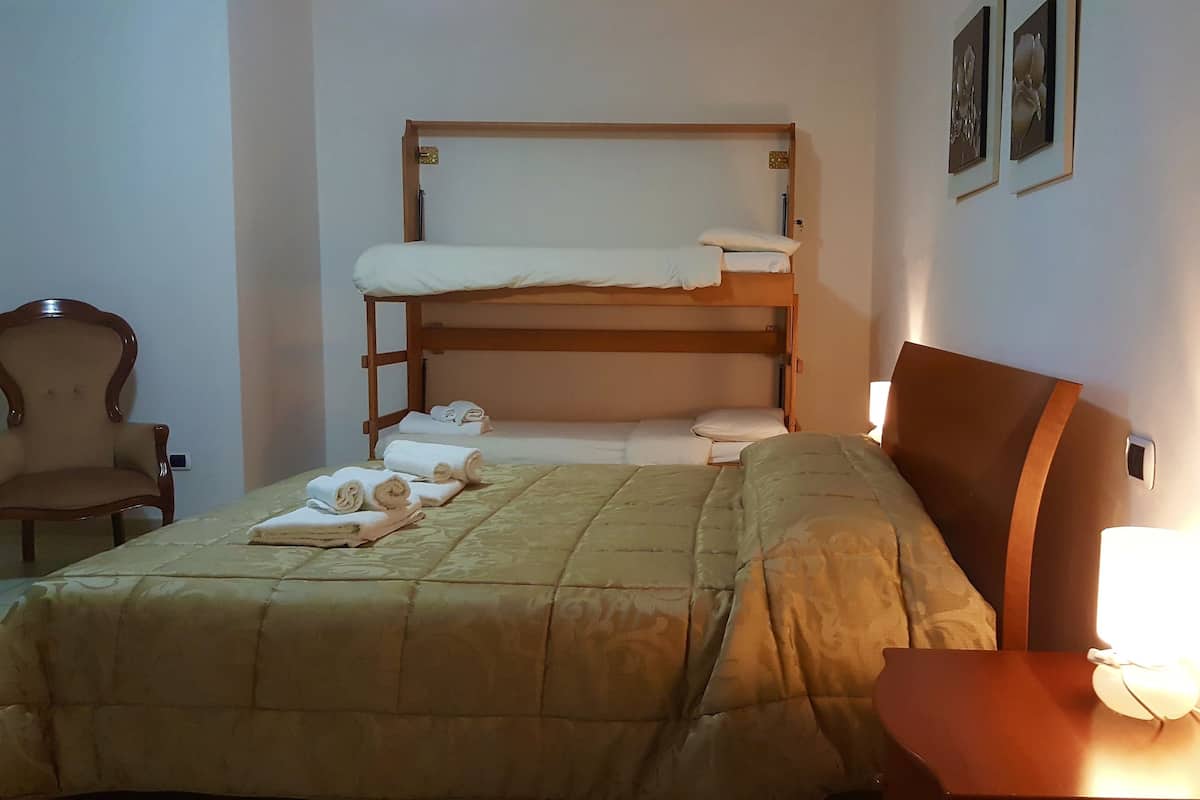 Family Quadruple Room, Private Bathroom | Desk, cribs/infant beds, bed sheets