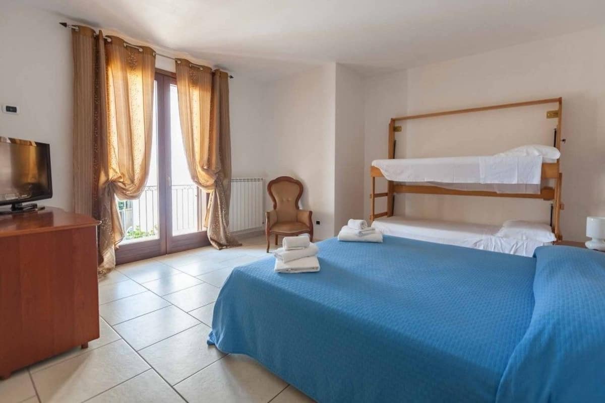 Family Quadruple Room, Private Bathroom | Desk, cots/infant beds, bed sheets