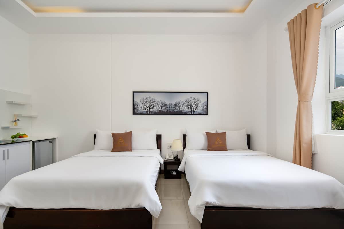 Premium bedding, memory-foam beds, minibar, desk