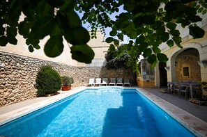 Seasonal outdoor pool, pool loungers