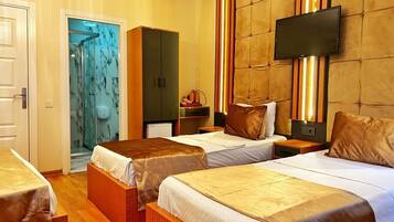 Standard Quadruple Room | Bathroom | Shower, free toiletries, hair dryer, slippers