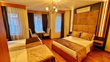 Standard Quadruple Room | In-room safe, desk, soundproofing, iron/ironing board
