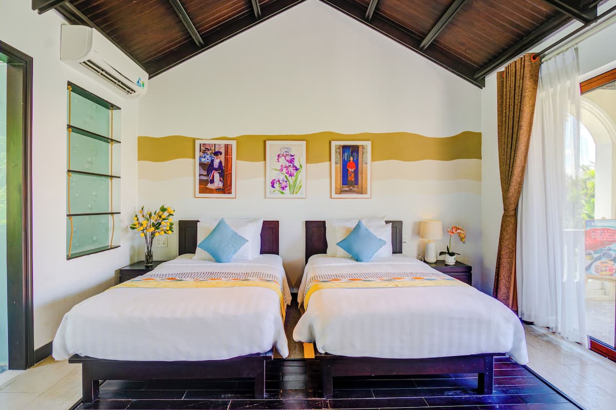 Deluxe Twin Room, Pool View | 1 bedroom, in-room safe, desk, laptop workspace