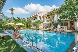 Outdoor pool, open 7 AM to 10:30 PM, pool umbrellas, pool loungers