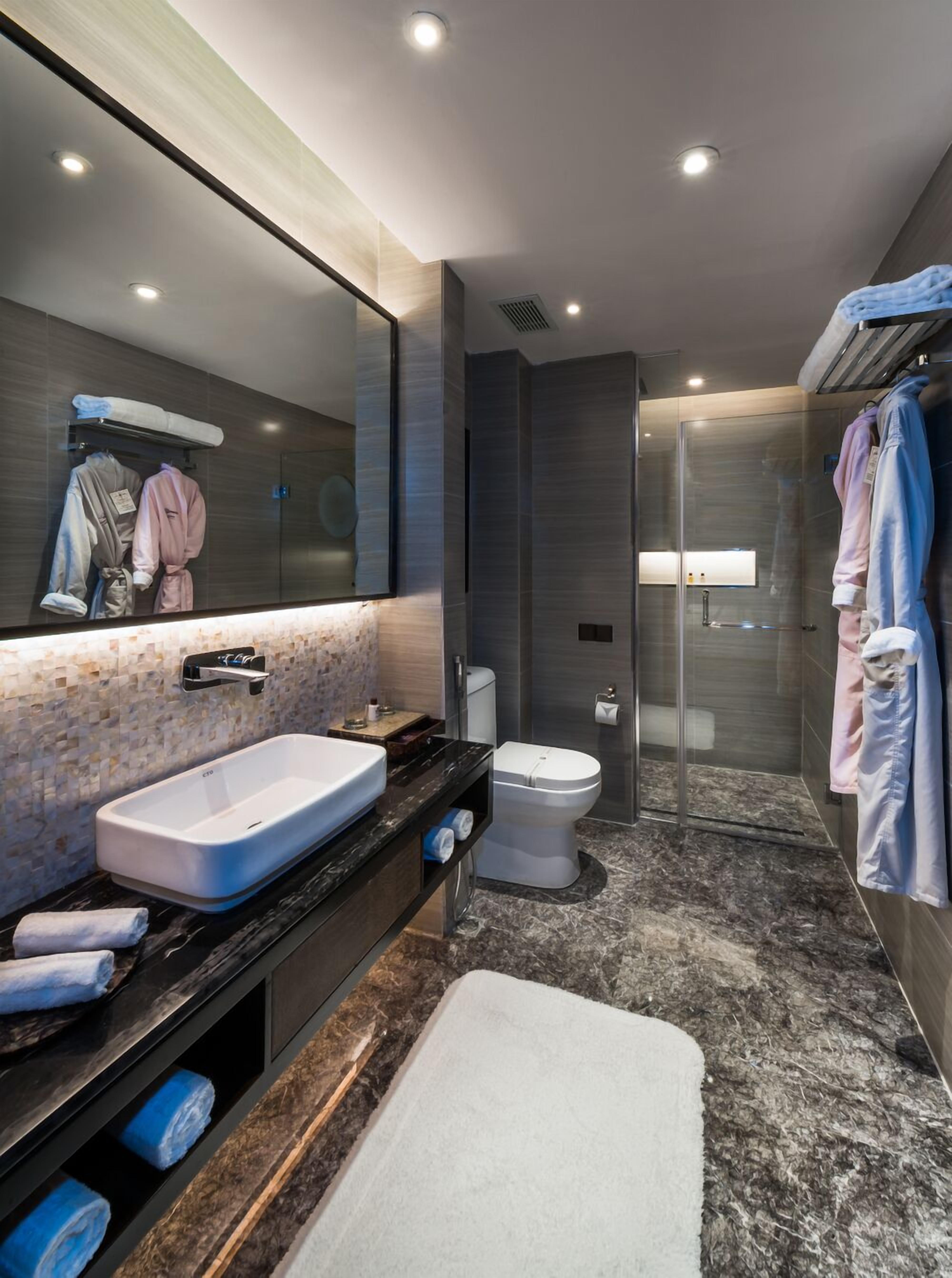 deep-soaking bathtub, rainfall showerhead, free toiletries, hair dryer