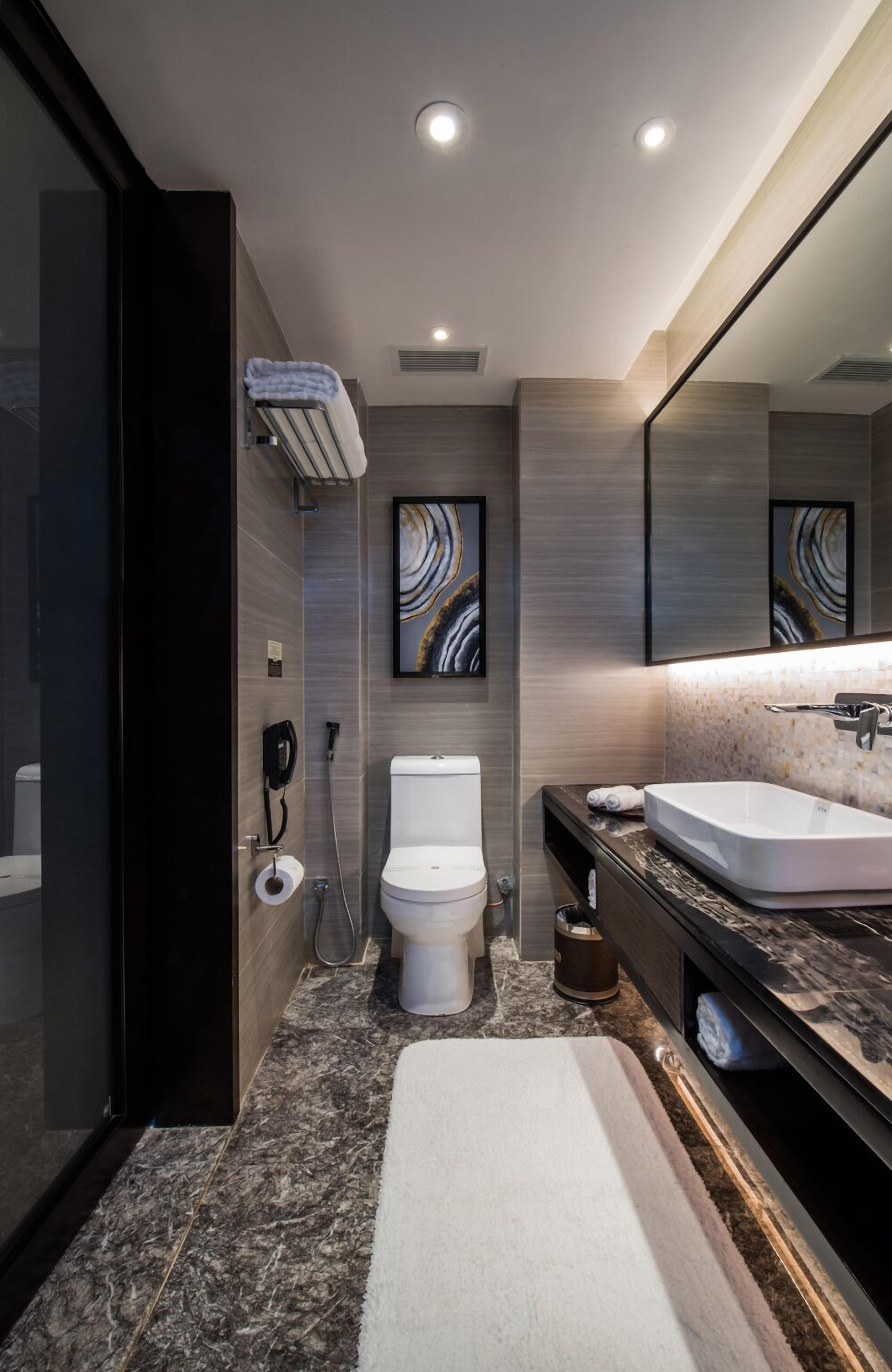 deep-soaking bathtub, rainfall showerhead, free toiletries, hair dryer