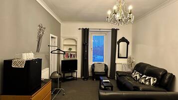 Deluxe Family Room (Room 2) | Living area | Flat-screen TV