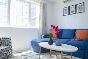 Grand Apartment, 2 Bedrooms, City View | Living area | 43-inch flat-screen TV with cable channels, TV, Netflix - Indigo BGC @ SOMA (Taguig)