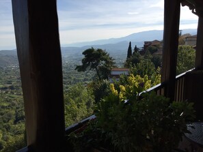 A view from a balcony overlooking a mountainous landscape with trees and buildings. - Varosi 4 Seasons (Edessa)