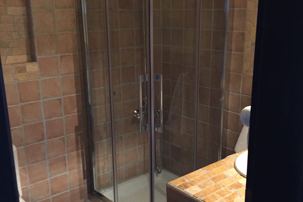 double room (village view) | bathroom | shower, hydromassage showerhead, free toiletries, hair dryer