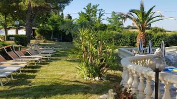 Outdoor pool, pool umbrellas, pool loungers