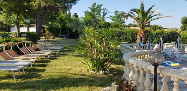 Outdoor pool, pool umbrellas, pool loungers