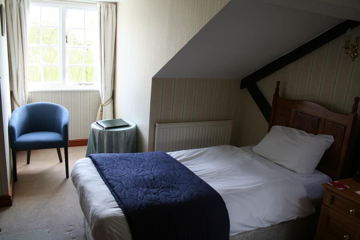Premium bedding, desk, laptop workspace, iron/ironing board