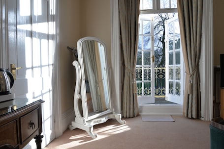 Premium bedding, desk, laptop workspace, iron/ironing board