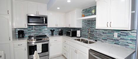 Condo, 2 Bedrooms | Private kitchen | Fridge, microwave, oven, dishwasher
