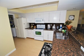 Condo, 2 Bedrooms | Private kitchen | Fridge, oven, coffee/tea maker, toaster