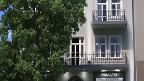 A two-story building with a storefront labeled "PAMIATKI". - Krupówki 17 Resort & Spa (Zakopane)