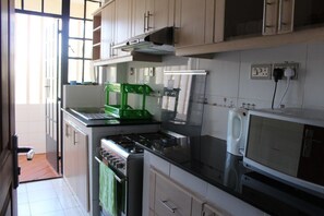 Appartamento, 1 camera da letto | Cucina privata | Frigorifero con congelatore, microonde, forno, piano cottura