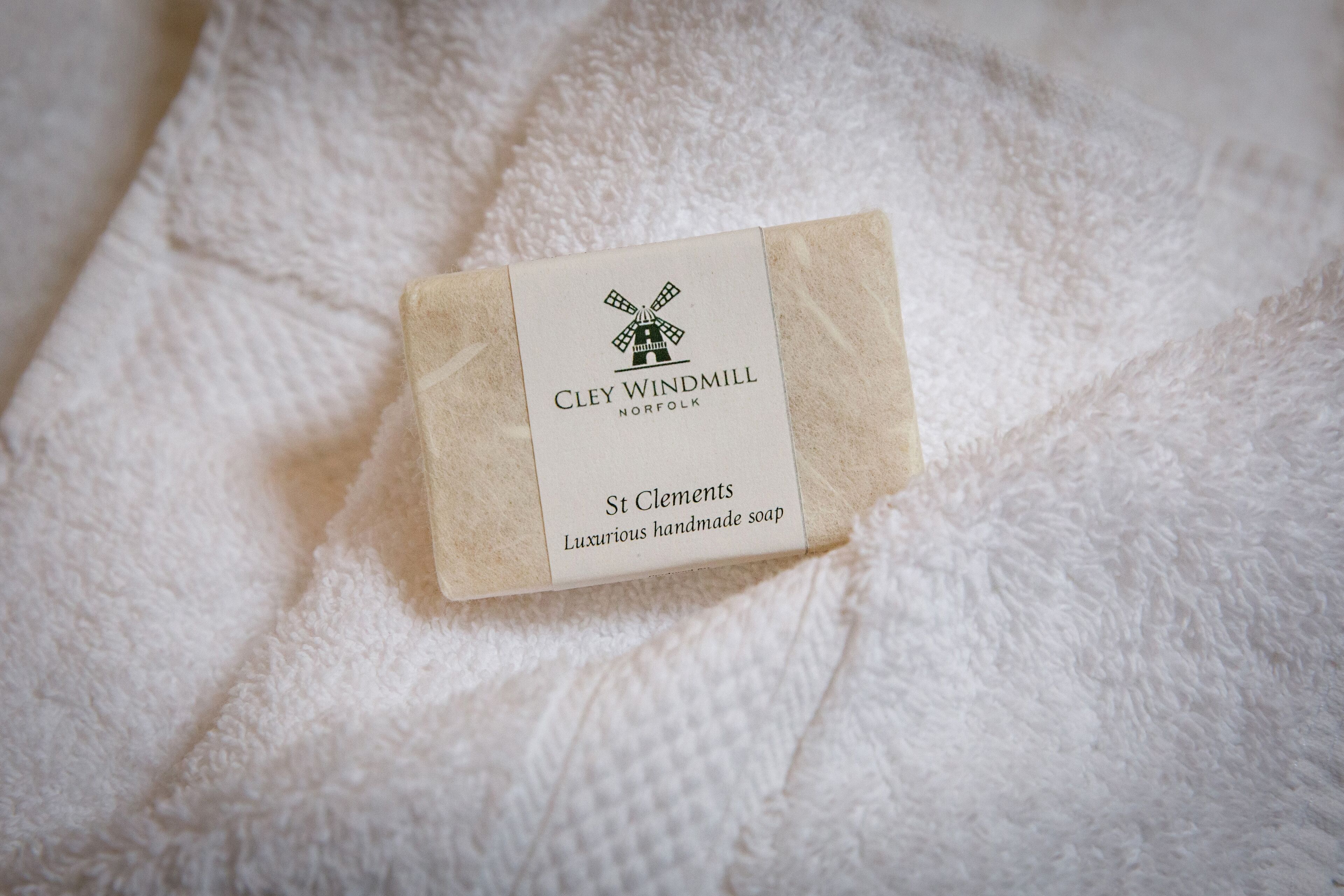 A small box of Clely Windmill St. Clements luxury handmade soap on a textured white surface.