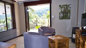 Luxury Room, 1 Bedroom, Non Smoking | Living room | 40-inch LED TV with satellite channels, TV - Normarie's Guesthouse (Wilderness)