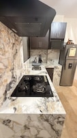 Apartment, 2 Bedrooms | Private kitchen | Full-size fridge, microwave, oven, stovetop