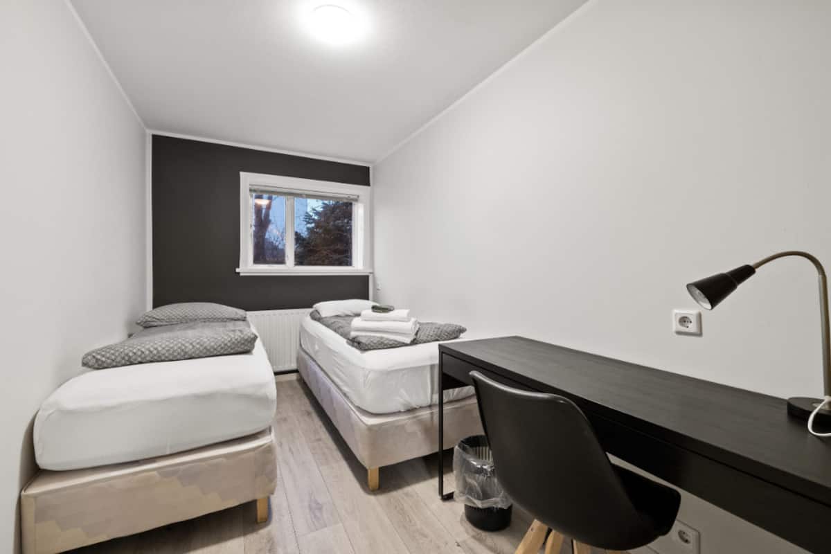 Twin Room, Shared Bathroom | Blackout drapes, cribs (free), WiFi (free), bed sheets