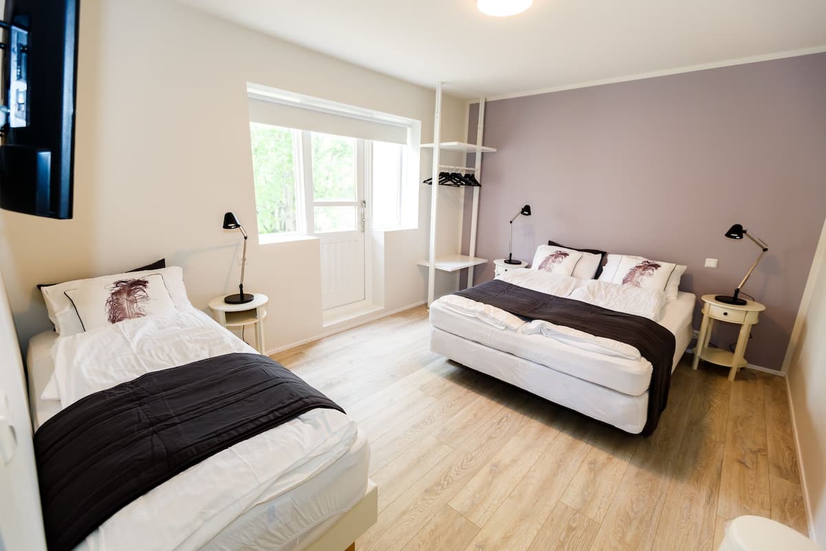Triple Room, Private Bathroom | Blackout drapes, cribs (free), WiFi (free), bed sheets