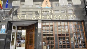 The exterior of Hotel Villa de Ribadeo with a prominent entrance, large windows, and a logo above the entrance. - Hotel Villa De Ribadeo (Ribadeo)