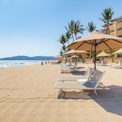 On the beach, sun loungers, beach umbrellas, beach towels