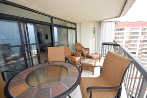 Relax on the balcony with wicker furniture and enjoy the view.