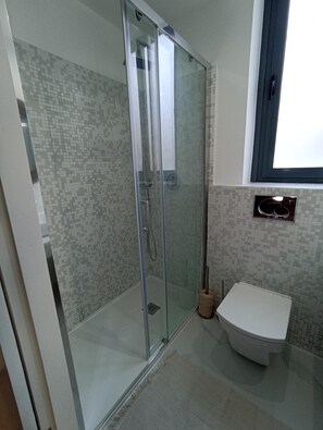 Shower, hair dryer, towels, soap