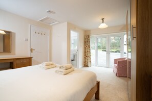 beautiful light bedroom with on-suite