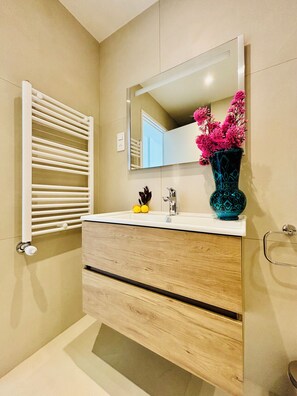 Bathtub, hair dryer, towels, soap
