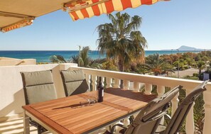 Enjoy ocean views and shaded seating on this balcony.