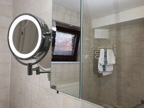 Bathtub, hair dryer, towels, soap