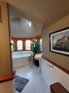 A bathroom with a large bathtub, a sink, and a potted plant. - The Trail's Edge / "Captain's Quarters" Is A Gorgeous Retreat, In Any Season. (Duluth)