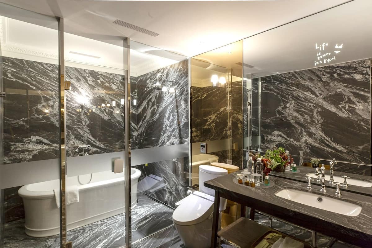 premium suite | bathroom | separate bathtub and shower, rainfall showerhead, hair dryer, slippers
