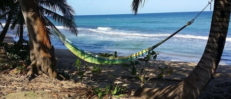 On the beach, sun loungers, beach towels