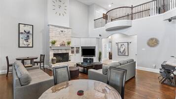 Smart TV, fireplace, table football, books