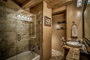 Combined shower/tub, hair dryer, towels, soap