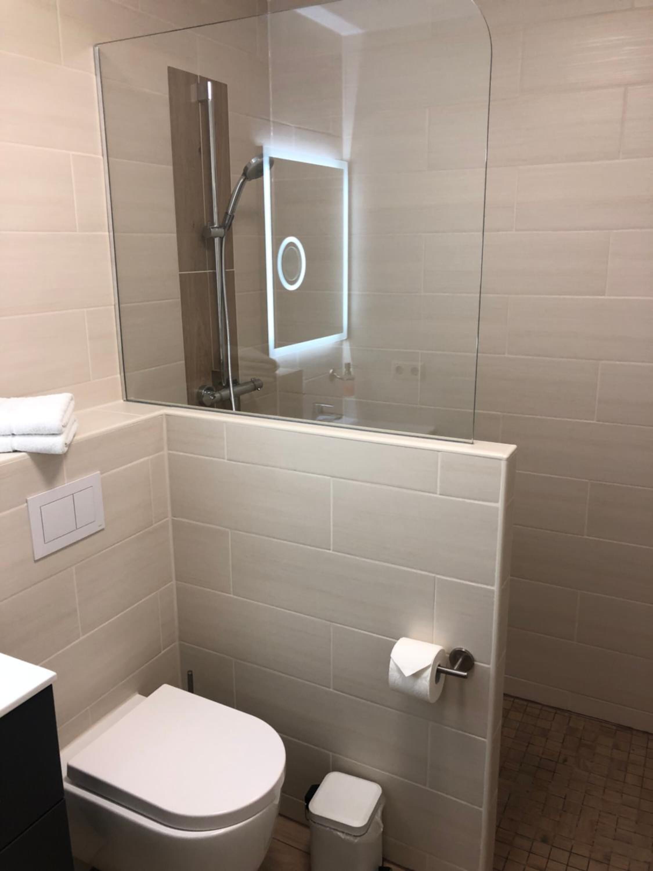 Shower, rainfall showerhead, hair dryer, towels