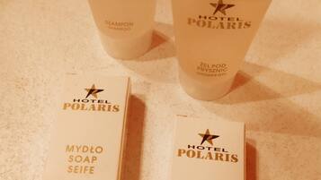 Three Hotel Polaris toiletry items: two shampoo bottles and two soap boxes.