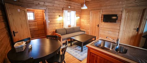 Traditional Cabin, 2 Bedrooms | Living area | Flat-screen TV, fireplace, table tennis
