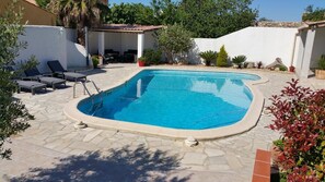 Seasonal outdoor pool, open 10:00 AM to 8:00 PM, pool umbrellas