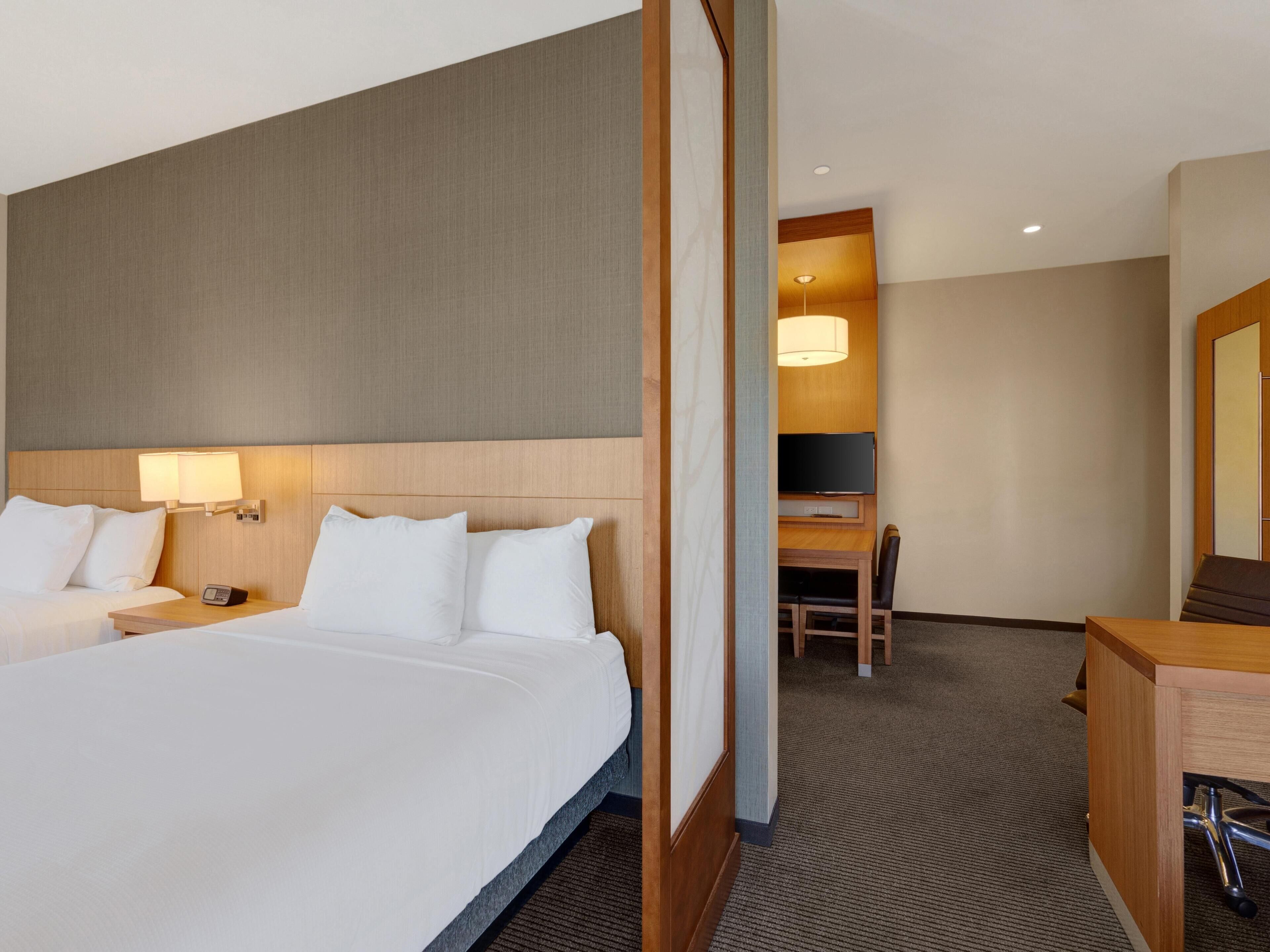 Suite, 2 Queen Beds with Sofa bed  | Hypo-allergenic bedding, down comforters, individually decorated, desk