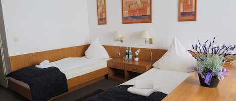 Desk, laptop workspace, blackout drapes, rollaway beds