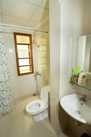 Shower, free toiletries, slippers, towels