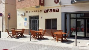 A restaurant named 'arasa' with outdoor seating and a visible entrance. - Hostal Restaurante Arasa (Santa Bárbara)