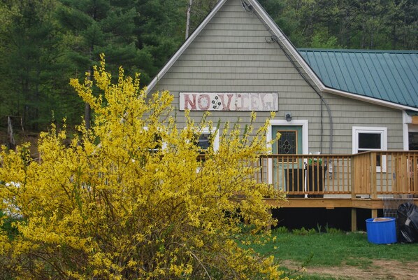 A building with a sign reading "NOWHERE" and a wooden deck. - No View Farm Inn & Bakery (Rumford)
