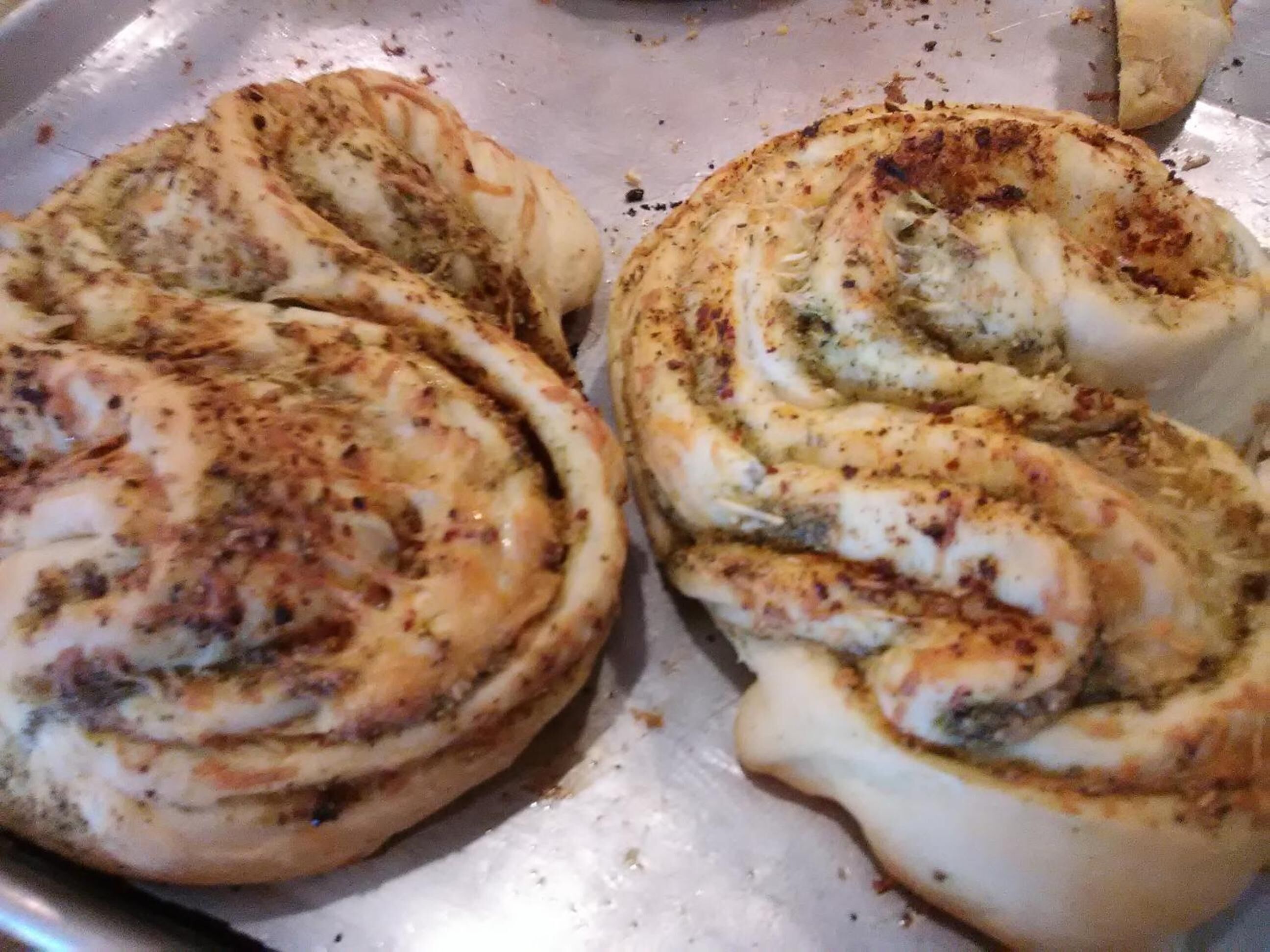 A tray with two cinnamon rolls.